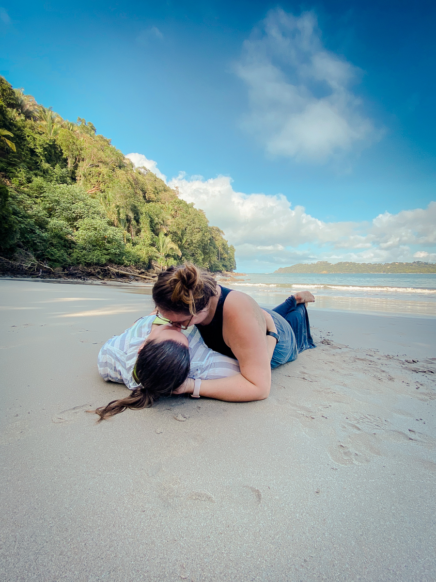 lesbian couple kissing on Manuel Antonio Beach