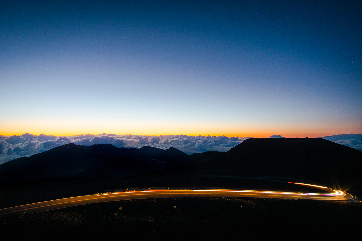 Long exposure car lights in front of Haleakala sunrise