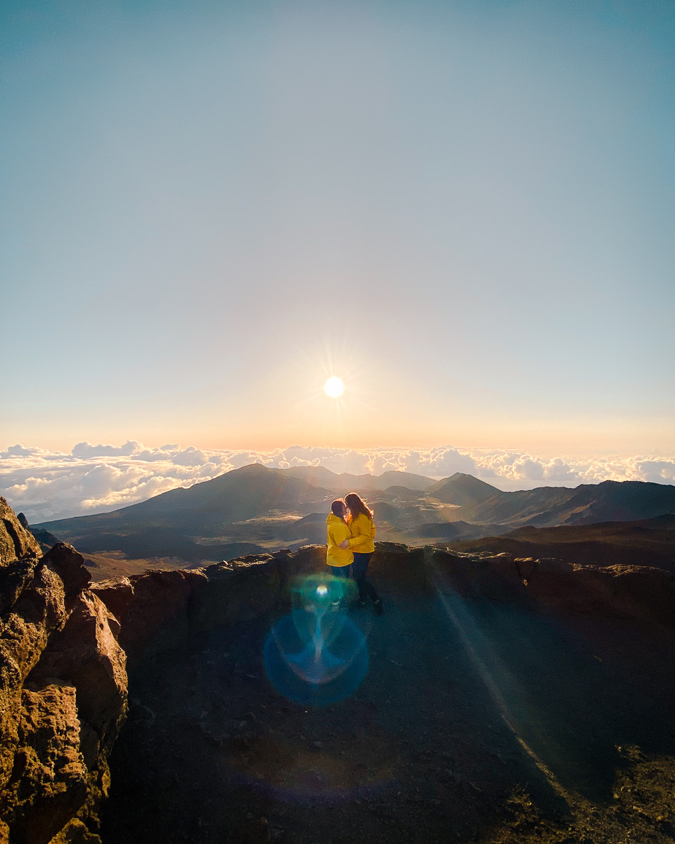 Two women near Haleakala crater at sunrise