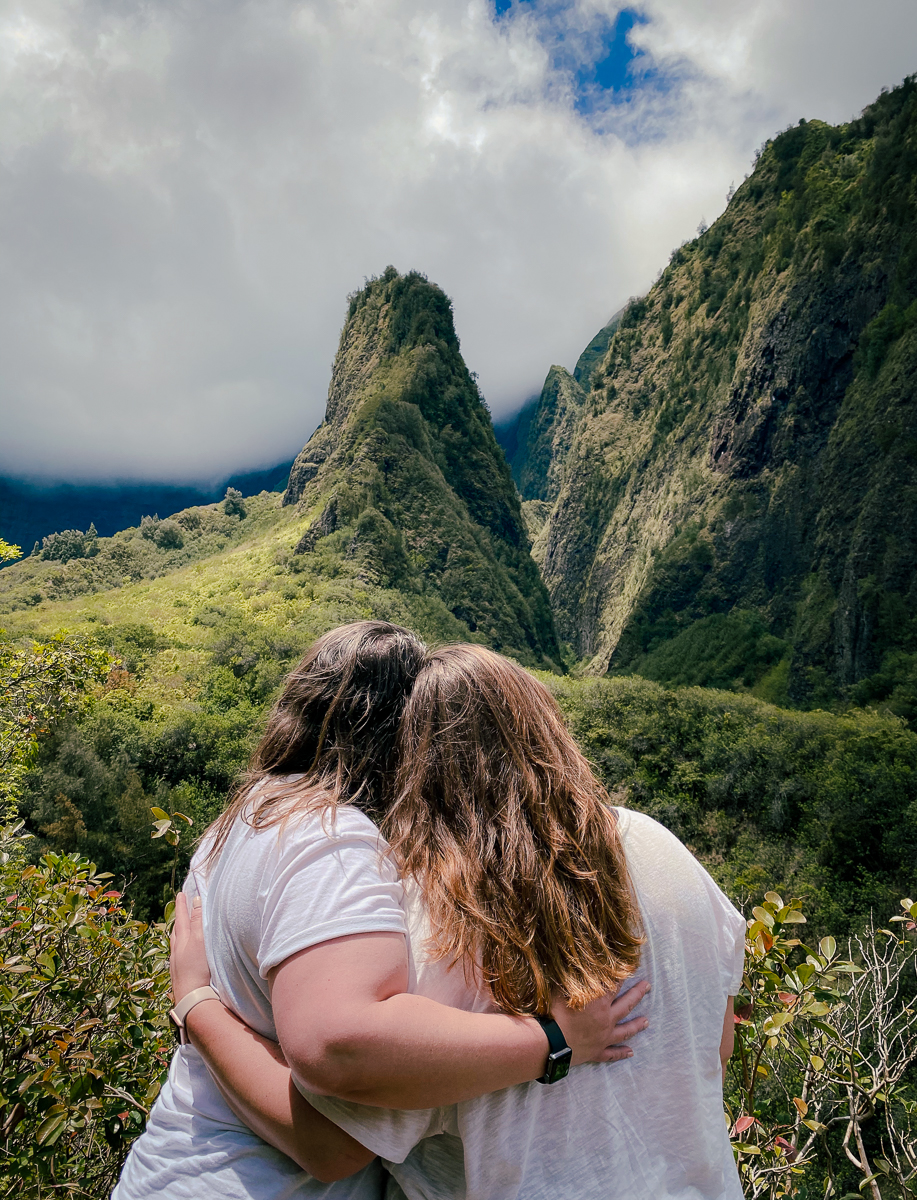 Lesbian couple gazing at Iao Valley State Monument