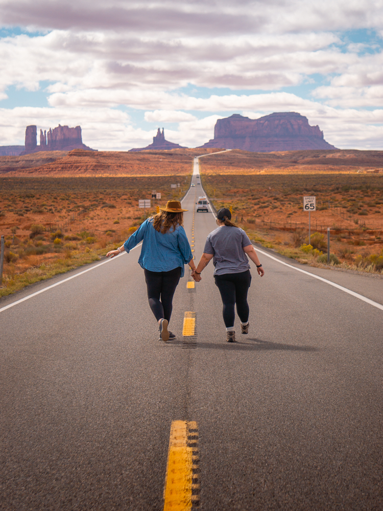 two women holding hands on grand circle road trip itinerary