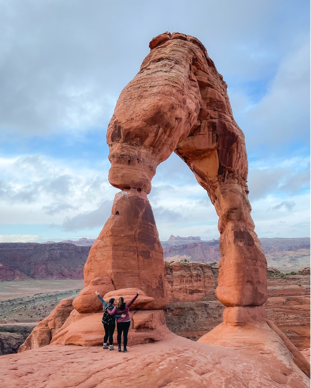 two women celebrating at arches national park