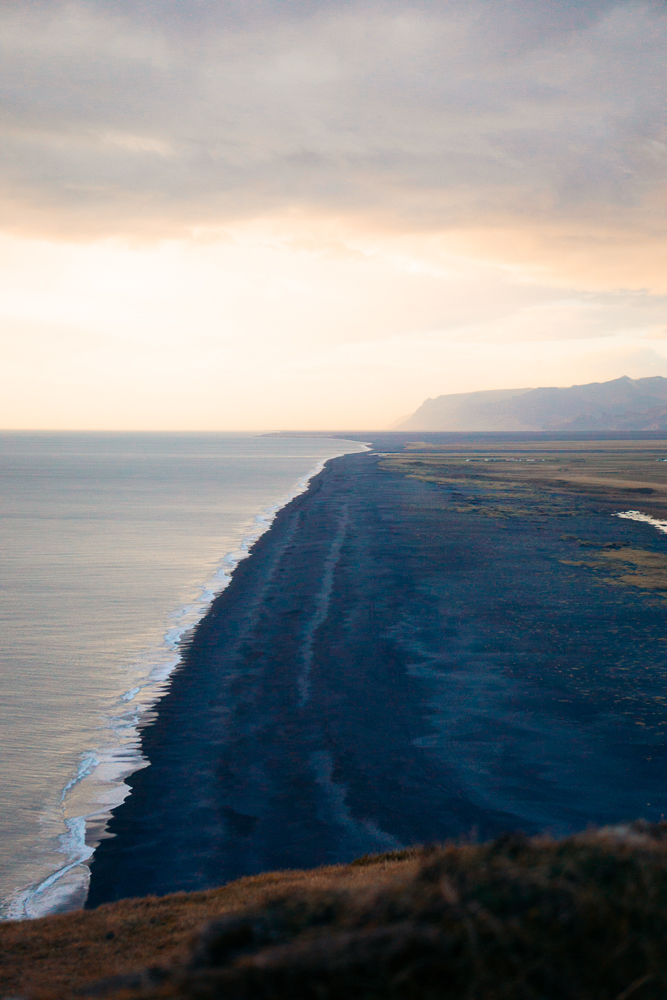 Sunset views of black sand beach at Dyrholaey Iceland